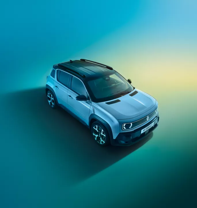 Aerial view of a modern white Renault compact SUV against a smooth blue-gradient background, showcasing the vehicle's contemporary design and stylish roof rails.