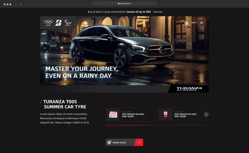 A screenshot of theDXP website design to showcase a Bridgestone Turanza T005 ad with a sleek black Mercedes on a rainy street under warm lights. The headline reads "Master Your Journey, Even on a Rainy Day.".